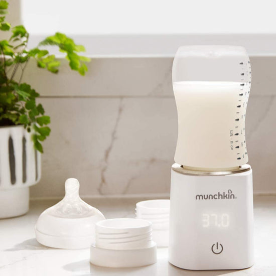 https://www.vanastenbabysuperstore.nl/media/catalog/product/2/9/2912160002_2_flessenverwarmer_munchkin_37_white.jpg
