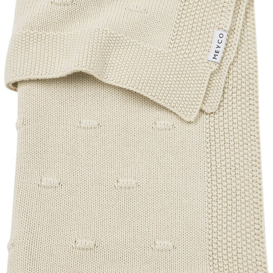 https://www.vanastenbabysuperstore.nl/media/catalog/product/4/5/4591901185_1_deken_wieg_meyco_knots_soft_sand_75x100.jpg