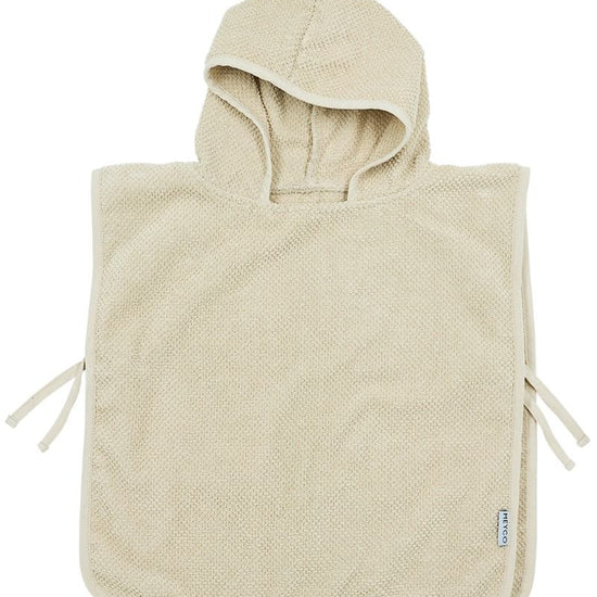 https://www.vanastenbabysuperstore.nl/media/catalog/product/4/5/4592030006_1_badponcho_meyco_popcorn_13_jaar_soft_sand.jpg