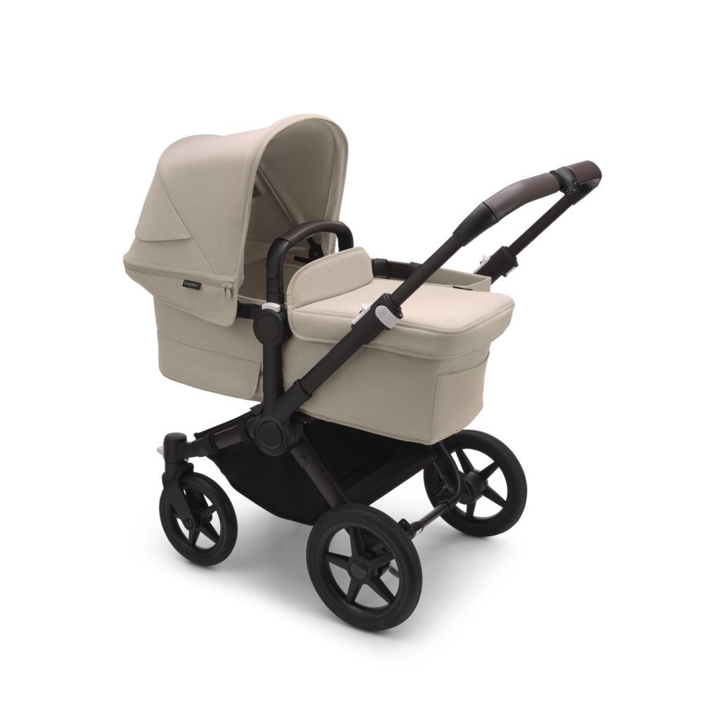 https://www.vanastenbabysuperstore.nl/media/catalog/product/7/5/7571100227_2_kinderwagen_bugaboo_donkey5_mono_complete_blackdesert_taupe_black_frame.jpg