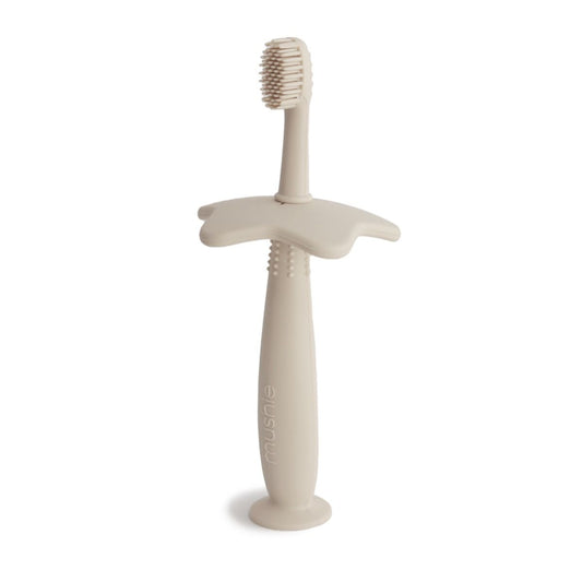 https://www.vanastenbabysuperstore.nl/media/catalog/product/8/2/8292110039_1_training_tandenborstel_mushie_star_shifting_sand.jpg