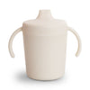 https://www.vanastenbabysuperstore.nl/media/catalog/product/8/2/8292800215_1_training_mushie_sippy_cup_ivory.jpg
