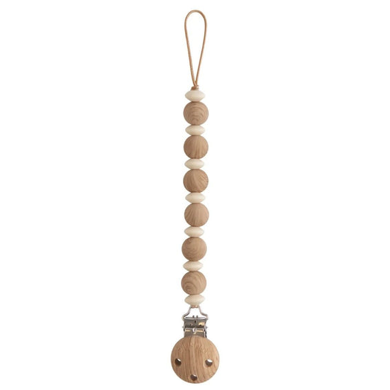 https://www.vanastenbabysuperstore.nl/media/catalog/product/8/2/8292800245_1_speenketting_mushie_luna_faux_wood.jpg