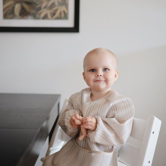 https://www.vanastenbabysuperstore.nl/media/catalog/product/8/2/8292870001_2_slabber_mushie_long_sleeve_boats.jpg
