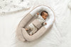 https://www.vanastenbabysuperstore.nl/media/catalog/product/9/9/9922100275_2_babynest_doomoo_cocoon_tetra_jersey_sand.jpg